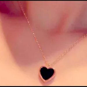 Solid black heart necklace